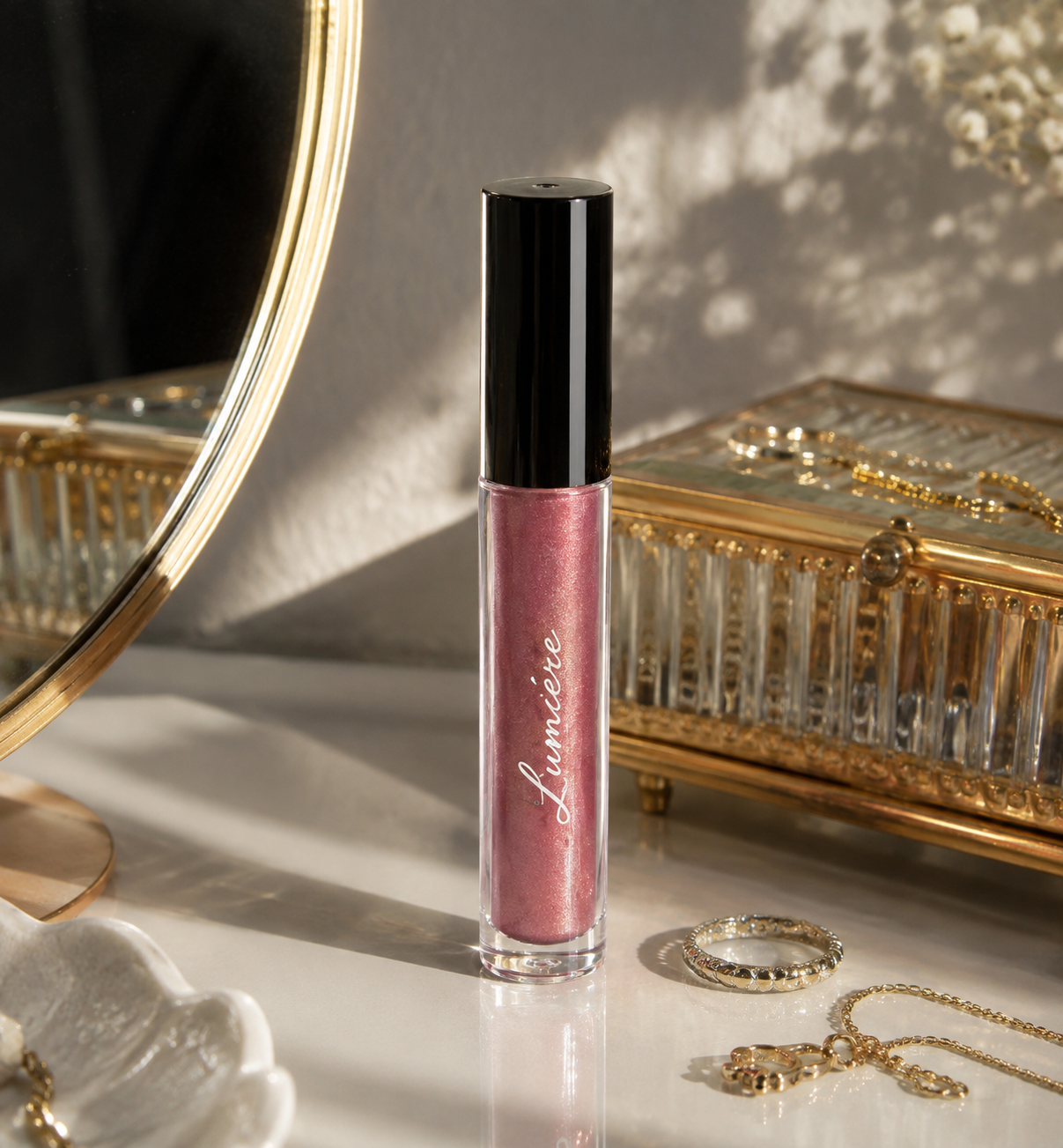 Lumière Mauve Glow lip gloss on a marble vanity